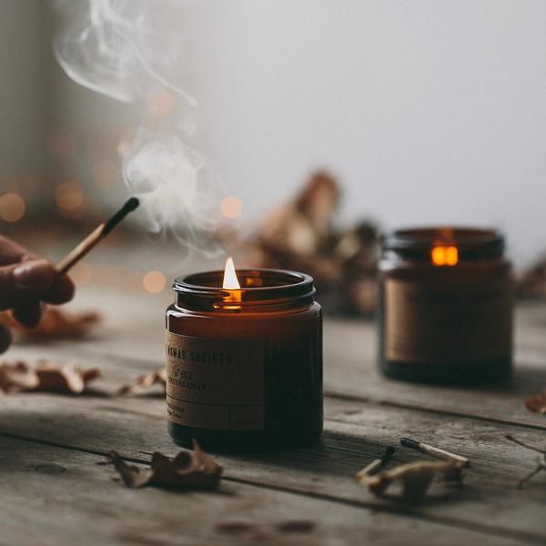 candle being lite by a match